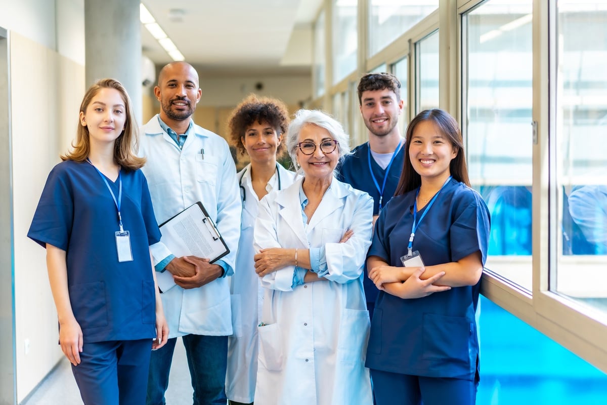 Portrait featuring a multi-ethnic medical team smiling confidently at the camera